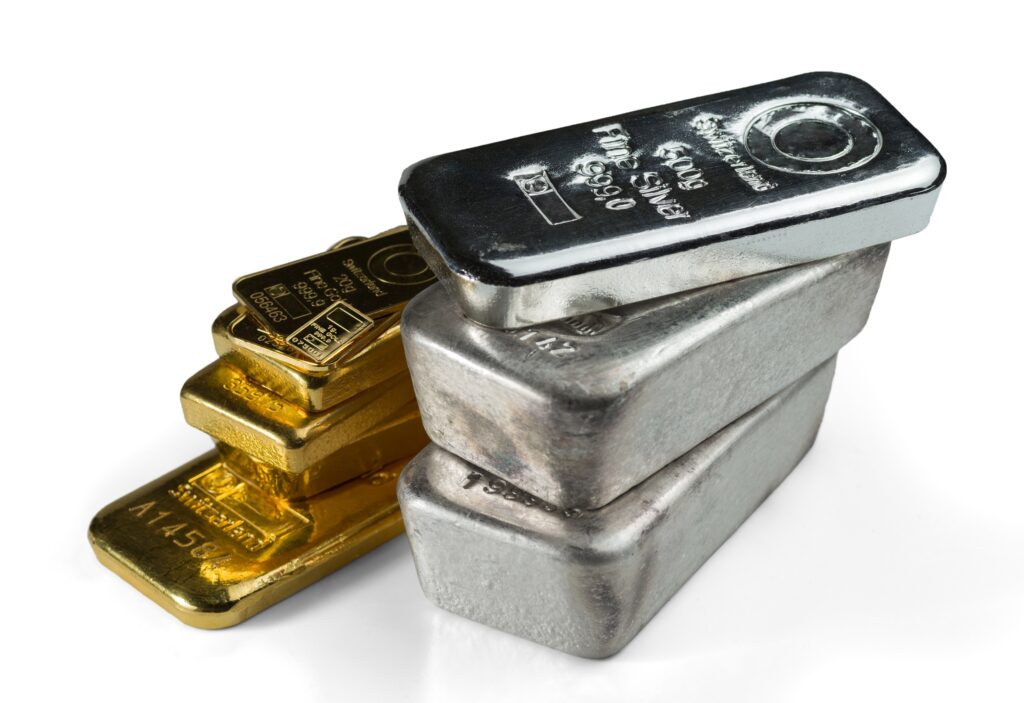 Different gold and silver bars stacked beside each other
