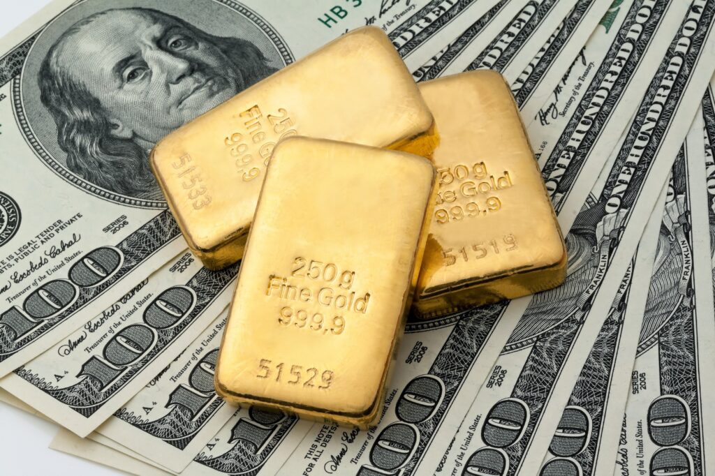 Gold bars on US dollar bills