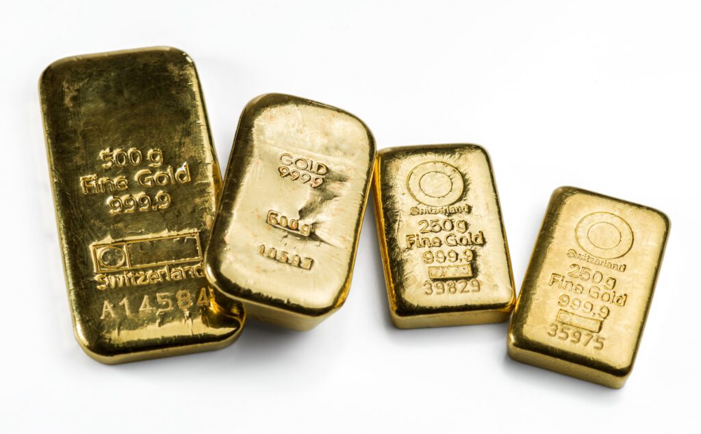 Four gold bars side by side