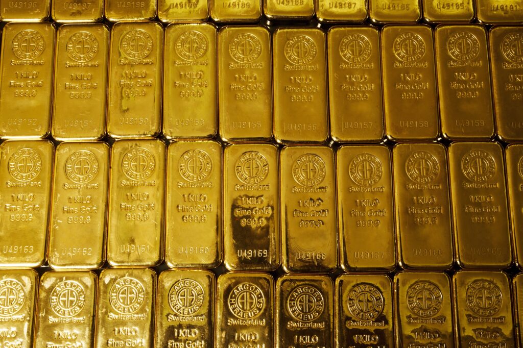 Dozens of 1 kg gold bars laid side by side