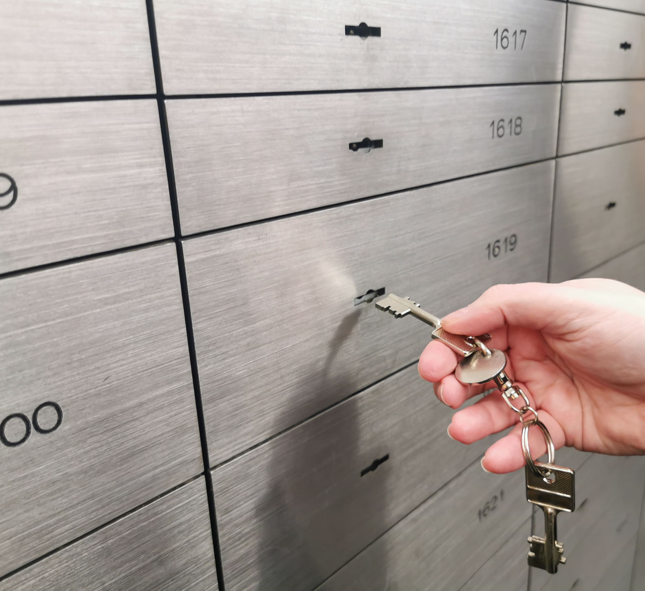 modern safe deposit boy is opened with a key