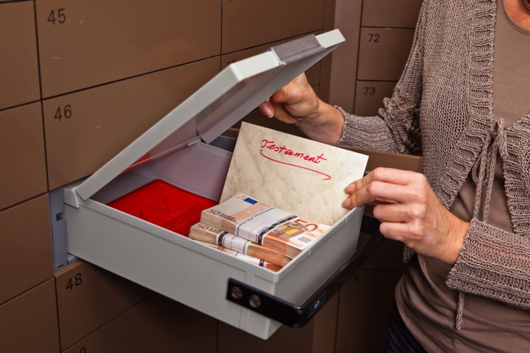 Opened safe deposit box with cash and documents