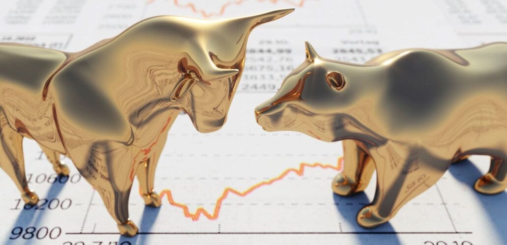 Bull and bear in front of stock market prices